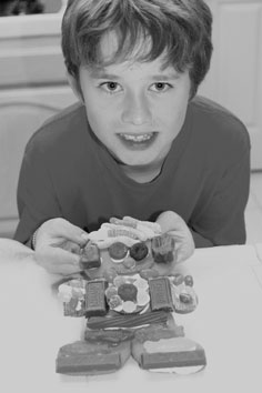 Austin watering his plant